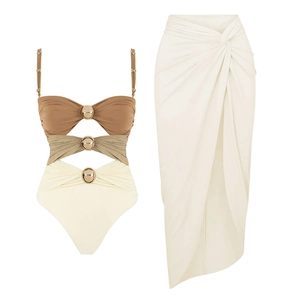 Detail of three-color cutout swimsuit with gold metal rings and matching wrap skirt