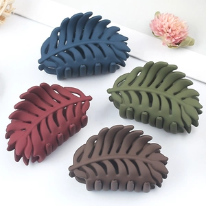 Leaf-shaped hair clips in navy blue, burgundy, army green, and brown matte finish