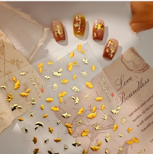 Detailed view of autumn ginkgo leaf nail stickers with metallic gold foil textures