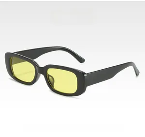 Detail of vintage square sunglasses with black frames and yellow transparent lenses