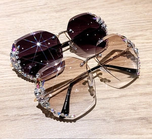 Detail of rhinestone trim on rimless sunglasses and gold metal arm with CT77418 model code