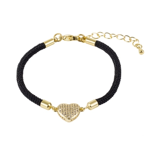Detail showing a braided black cord bracelet with a gold heart pendant and lobster clasp