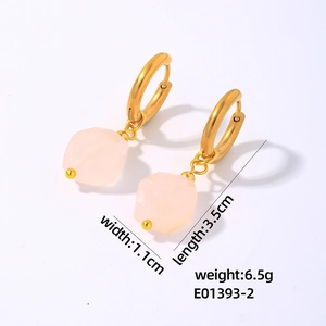 Detail view of geometric gold earrings with pink stones showing size 3.5cm by 1.1cm