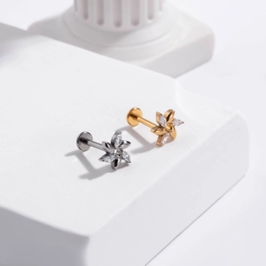 G23 titanium flower labret studs with zircon crystals in gold and silver finishes