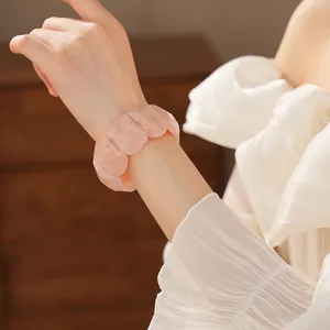 Pink acrylic resin cuff bracelet featuring a minimalist chunk design on woman's wrist