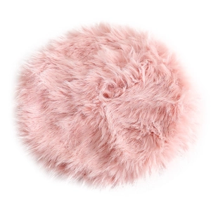 Pink round faux fur Christmas tree skirt with long shaggy texture on a white background