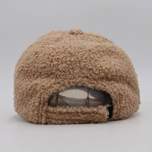 Detail of camel faux lamb wool baseball cap featuring adjustable velcro strap on back