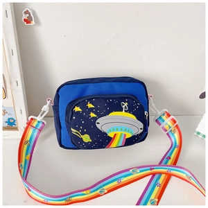 Detail of blue kids crossbody bag with UFO pattern and rainbow adjustable shoulder strap