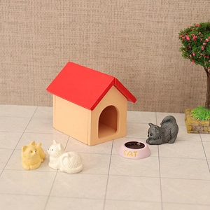Miniature wooden dollhouse cat house model with red roof and three tiny toy cats