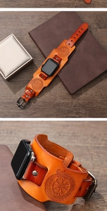 Close-up of brown leather wide cuff strap with Viking compass for Apple Watch