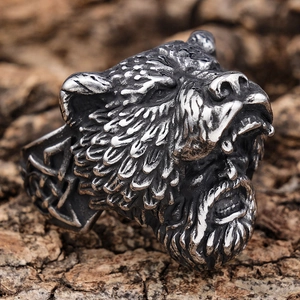 Macro shot of detailed bear head relief and Celtic knots on vintage stainless steel ring