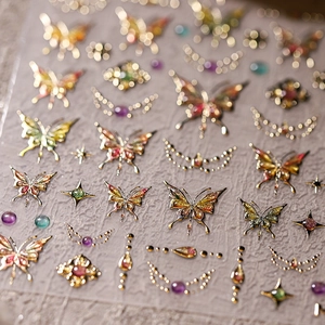 3D butterfly nail art stickers with metallic gold foil and colorful gradient designs