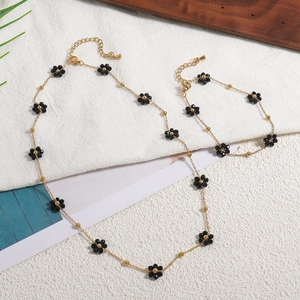 18K gold plated daisy jewelry set with black faceted beads and delicate chain necklace