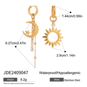 Detail view of gold stainless steel sun and moon earrings with size measurements