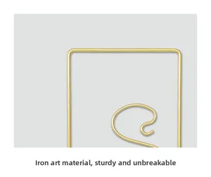 Detail of sturdy golden iron wire frame showing smooth Nordic minimalist finish