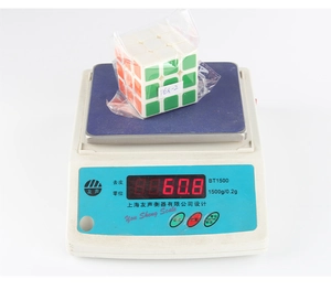 Macro detail of a 3x3x3 speed cube showing white base and colorful stickers