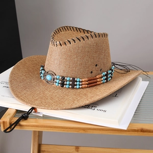 Brown straw cowboy hat featuring turquoise beaded trim and adjustable chin strap