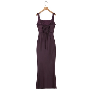 Detail view of the back criss-cross lace-up design on this purple fishtail maxi dress