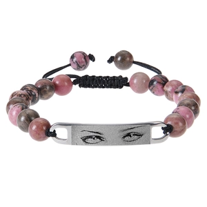 Detail of beaded bracelet with pink rhodonite stones and custom eye engraved metal plate