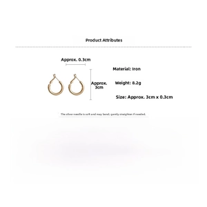 Detail view of 3cm golden hoop earring showing 8.2g weight and 0.3cm thickness