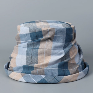 Detail of blue plaid bucket hat showing textured cotton fabric and rolled brim design