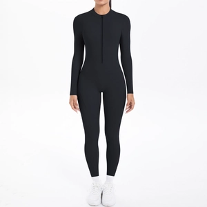 Close-up of black long sleeve athletic bodysuit featuring a front zipper and matte finish