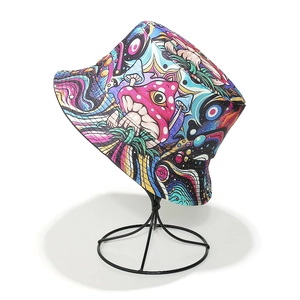 Close-up of bucket hat featuring vibrant psychedelic mushroom and eye pattern prints