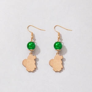 Detailed view of squirrel pendants with green pearls on gold festive drop earrings