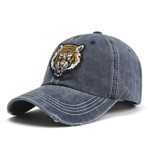 Distressed cotton baseball cap with vintage tiger embroidery and white contrast stitching