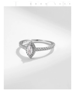 Macro view of marquise-cut zirconia ring with halo setting and S925 silver stamp