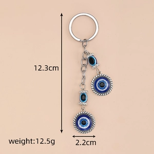Detail view of Evil Eye keychain measuring 12.3cm with weight and size specifications