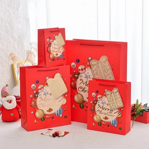 Red Christmas gift bags in four sizes with ribbon handles and festive holiday patterns