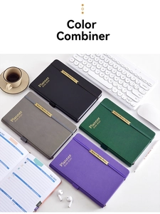 Detail showing faux leather planner covers in four colors with elastic bands and metal trim