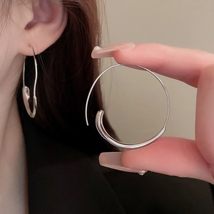 Minimalist silver geometric round hoop earrings with glossy metallic finish for women