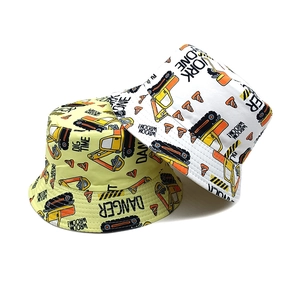 Kids reversible bucket hats with cartoon excavator and crane prints in yellow and white