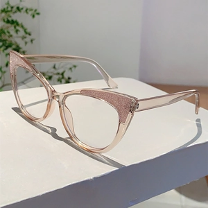 Detail of cat-eye glasses with champagne glitter frame and blue light blocking lenses