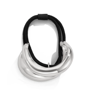 Close-up of black elastic hair tie with tiered silver metal curved decorative piece