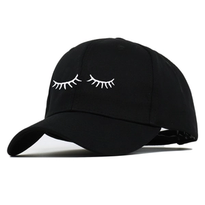 Classic black baseball cap featuring white eyelash embroidery with a curved brim design