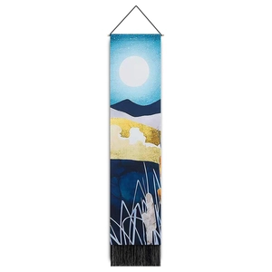 Vertical wall tapestry detail showing gold foil mountains, moon, and black tassels