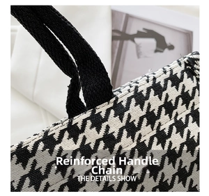 Detail showing high-density black strap and houndstooth woven texture on a tote bag
