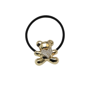 Elastic black hair tie with golden bear pendant and heart rhinestone on white background