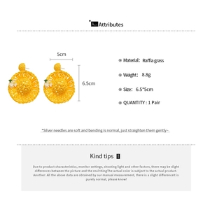 Detail view of woven raffia sun hat earrings with dimensions and product specifications