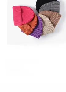 Detailed view of colorful ribbed knit beanies in various vibrant winter colors
