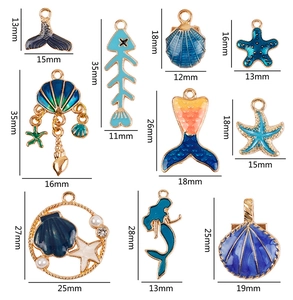 Detail view of blue ocean charms showing mermaid, starfish and shell alloy dimensions