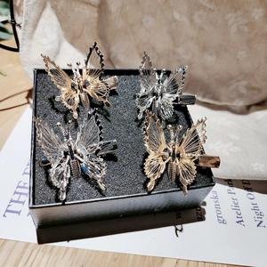 Elegant 4-piece moving butterfly hair clips in gold and silver finish for women