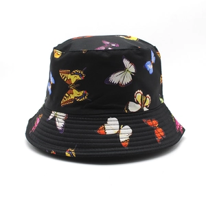 Black cotton bucket hat with colorful butterfly print and quilted brim for sun protection