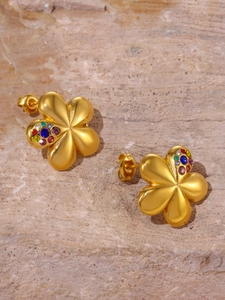 Detailed close-up of golden flower stud earrings with vibrant multi-color zircon stones