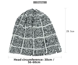 Flat lay display of check pattern knit beanie showing 29.5cm height and 30cm width specs