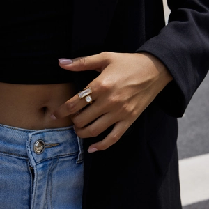 Detail shot of a gold-plated stainless steel ring with square and rectangular crystals