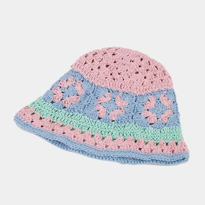 Detail of colorful hand-crocheted floral patterns on a vintage hollow knit bucket hat